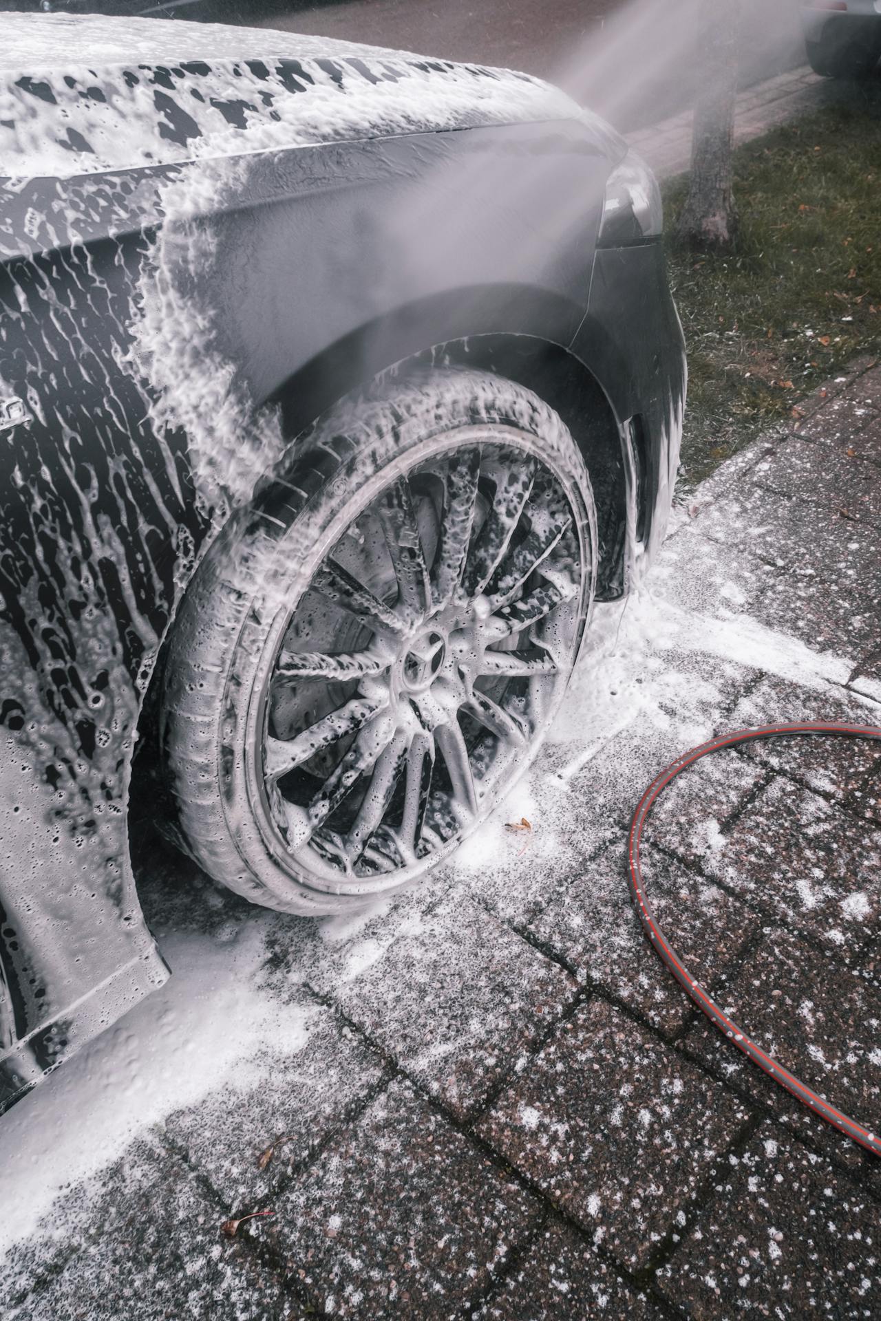 A mobile detailing business washing a car
