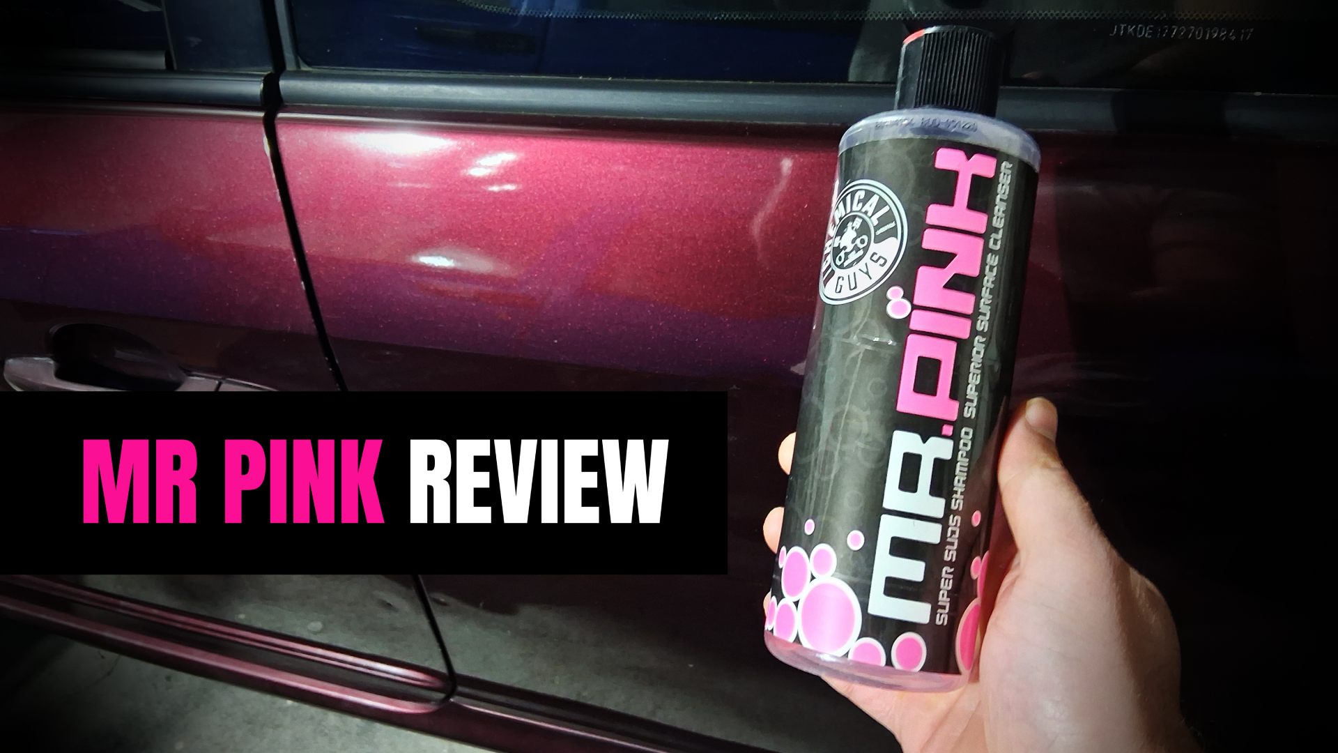 mr pink review with bottle held beside clean car